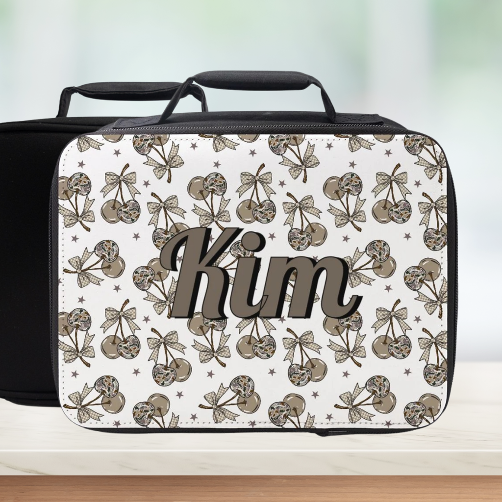 Lunch bag with a camo cherry pattern and personalized name on a white background