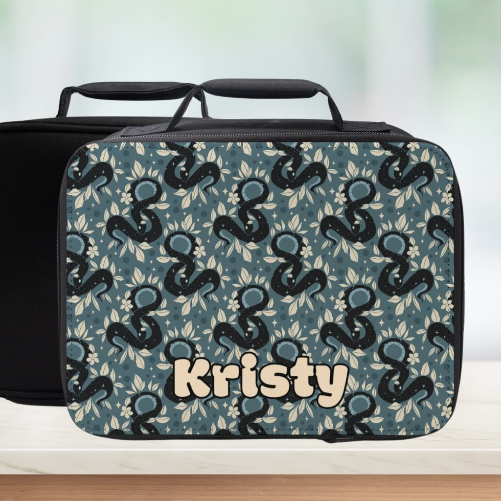 Patterned lunch bag with 'Kristy' personalized name on a blurred background