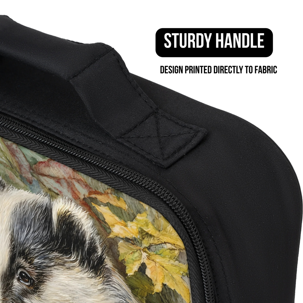 Black lunch bag with a printed design of a pig and leaves on a white background