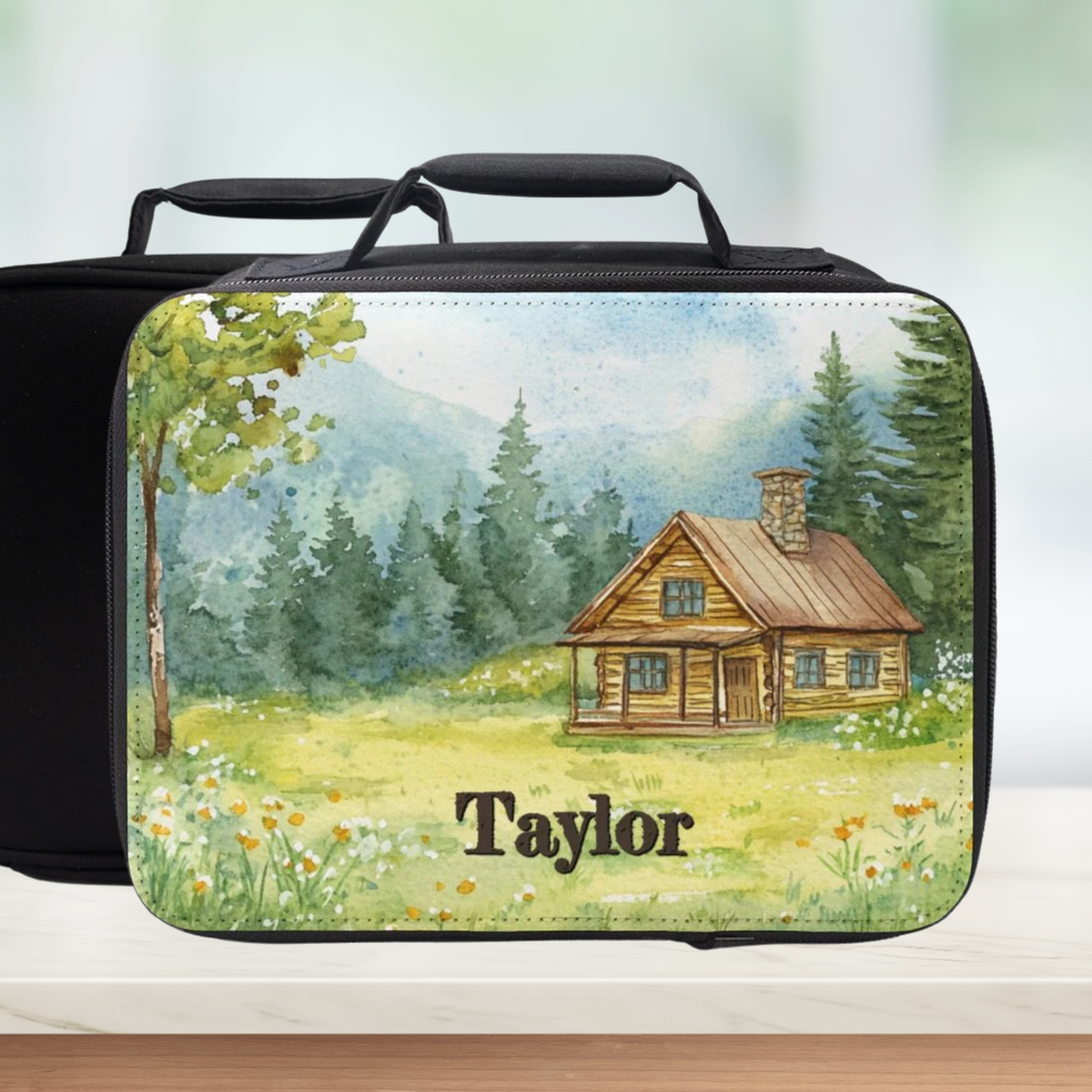  insulated lunch bag with a cabin design and personalized name on a kitchen counter.