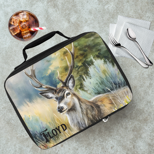 Lunch bag with deer design and 'Floyd' custom name text on a table with a drink and utensils.