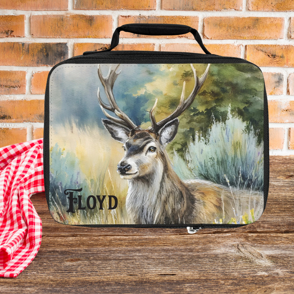 Lunch bag with deer design and 'Floyd' custom name on a wooden picnic table with brick wall background