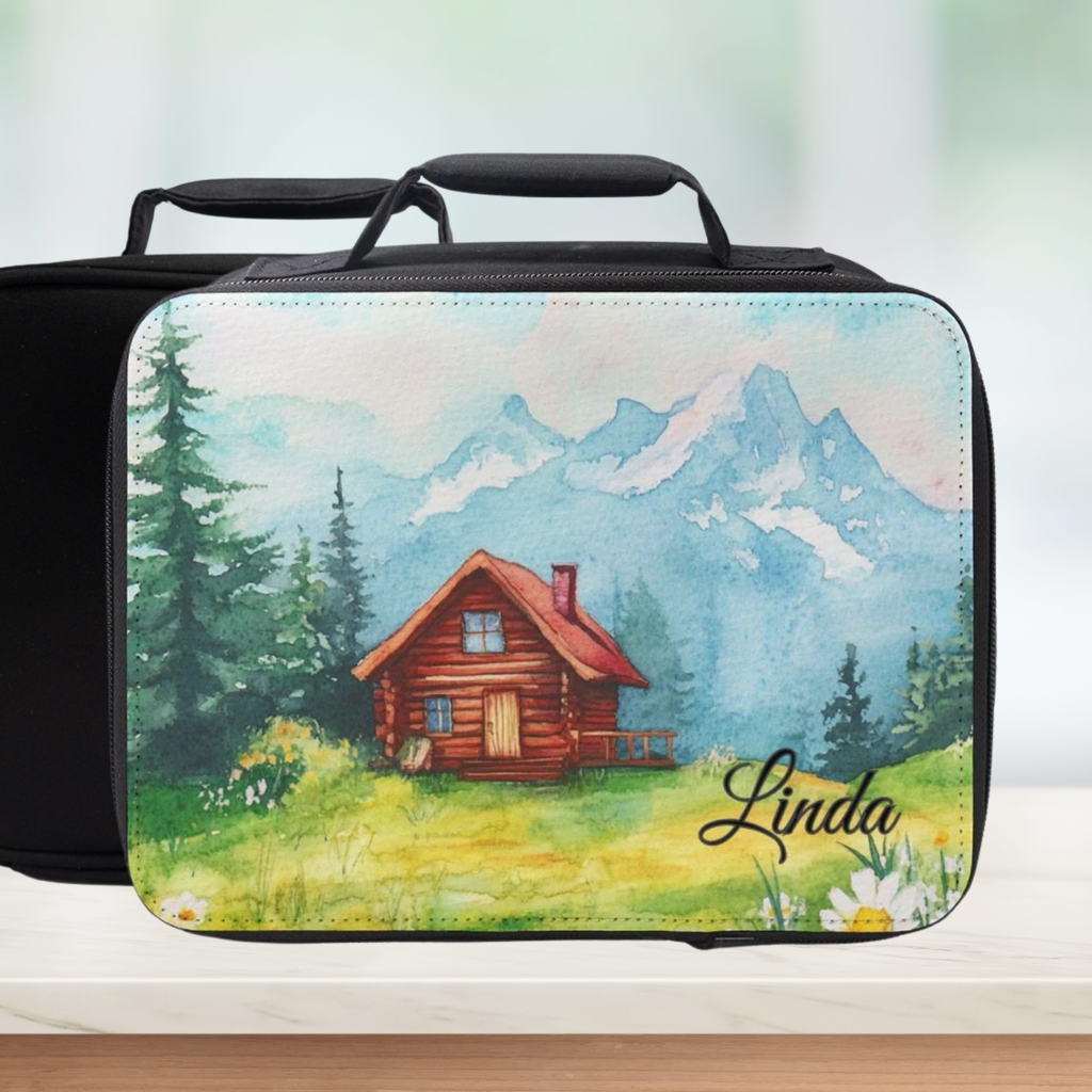 Black lunch bag with a scenic design of a cabin and mountains, personalized with 'Linda'.