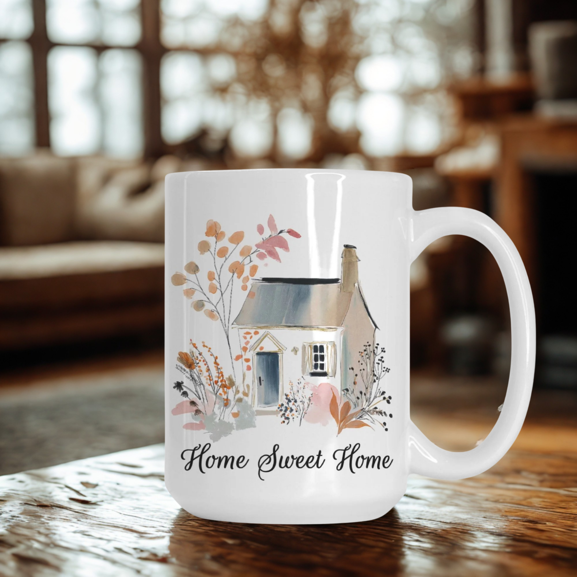 White mug with a house illustration and 'Home Sweet Home' text on a wooden table.