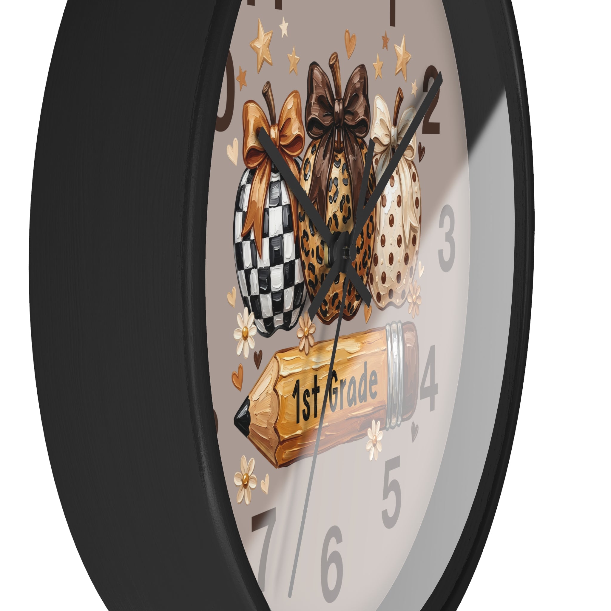 Wall clock with decorative design of checkered, leopard print, and polka dot bows with a 1st Grade book on a gray background.