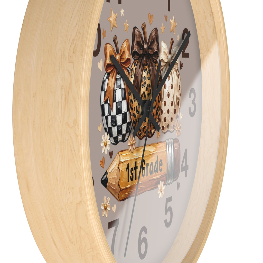 Wall clock with decorative design of checkered, leopard print, and polka dot bows on a gray background.