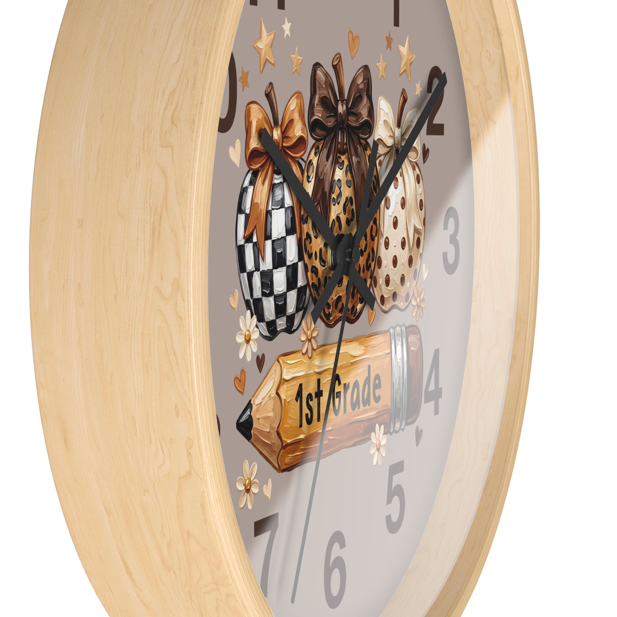 Wall clock with decorative design of checkered, leopard print, and polka dot bows on a gray background.