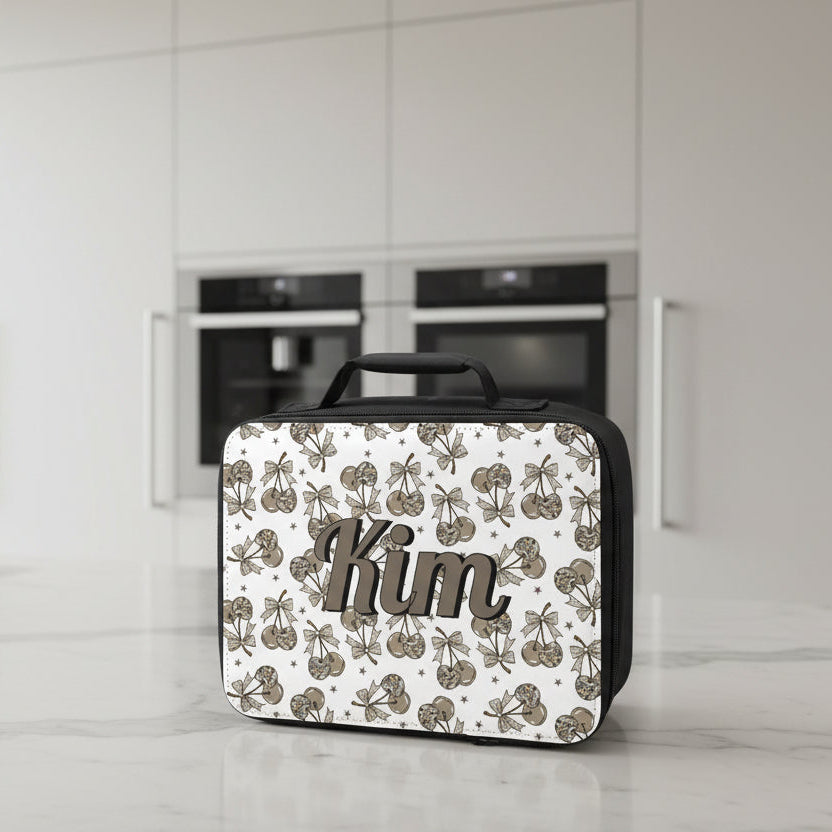 Lunch bag with a personalized name printed on it and decorative camo cherry pattern