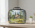  insulated lunch bag with a cabin in the woods design and the name 'Julie' on a white background