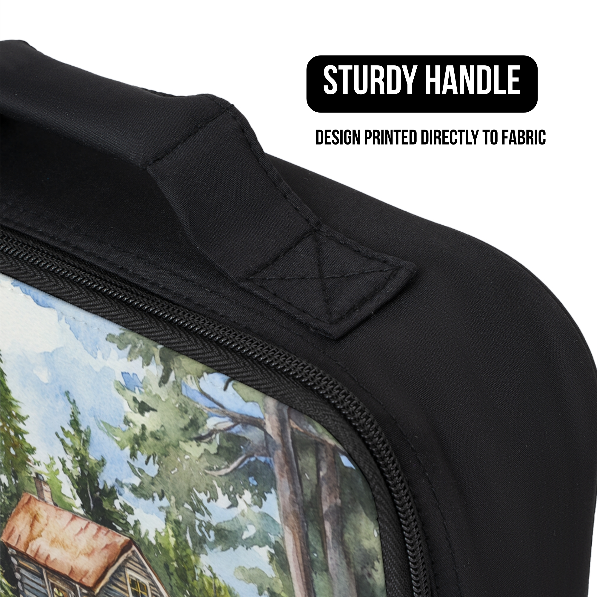 Black lunch bag with a scenic design of a cabin in the woods, featuring a sturdy handle and design printed directly to the fabric.