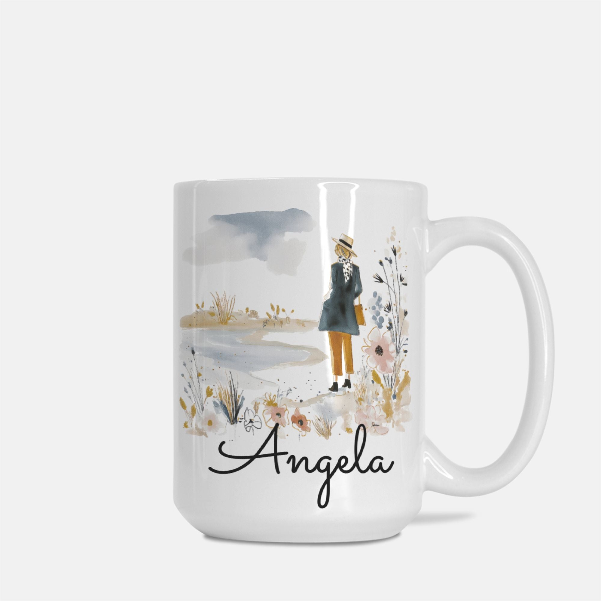 Mug with a scenic design and the name 'Angela' on a white background