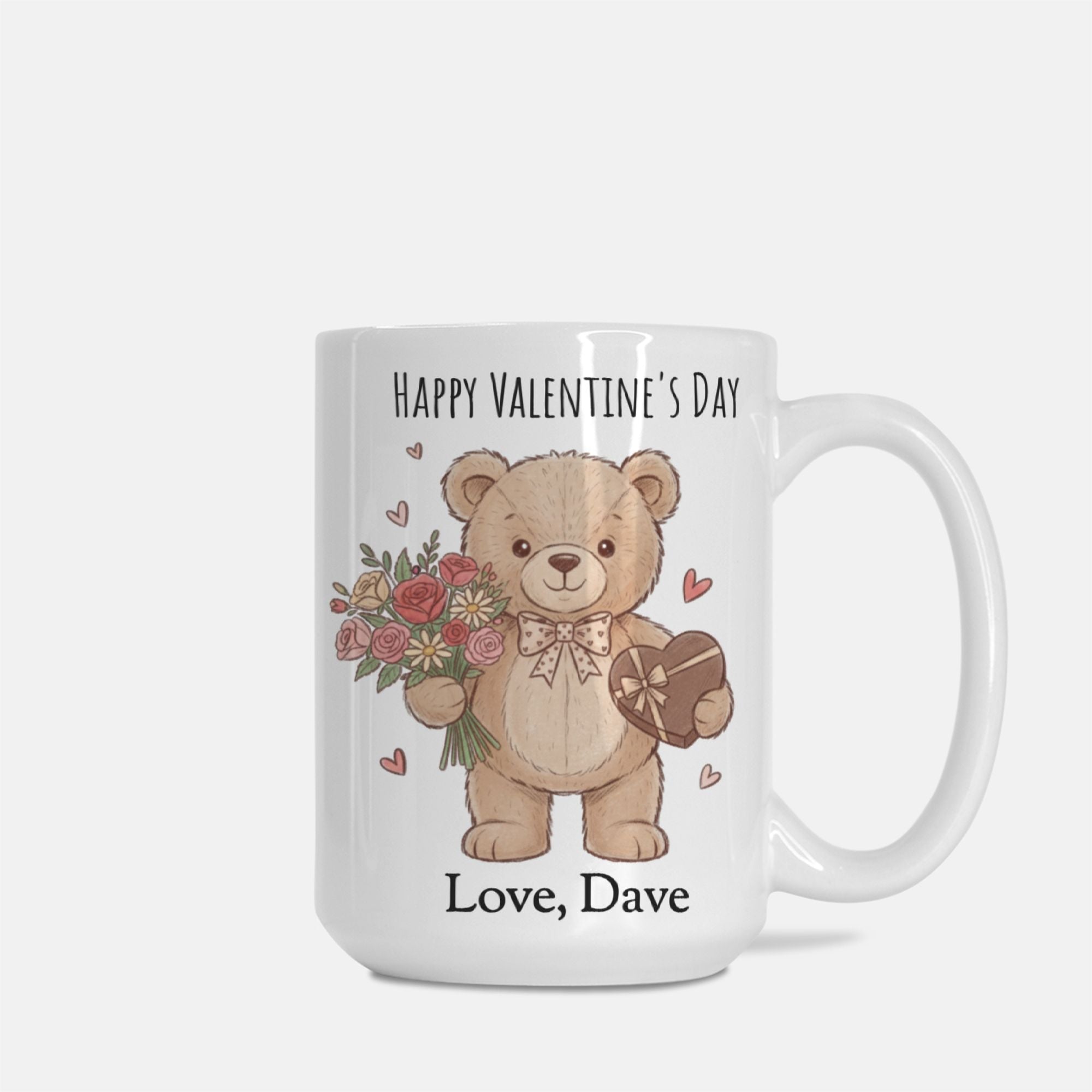 Mug with a teddy bear holding flowers and a heart, and 'Happy Valentine's Day' text on a white background.