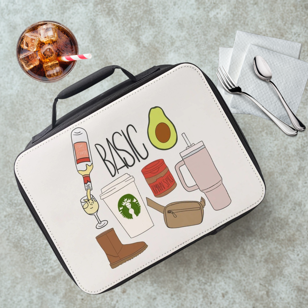  insulated lunch bag with illustrations on a cafeteria table with a drink and utensils