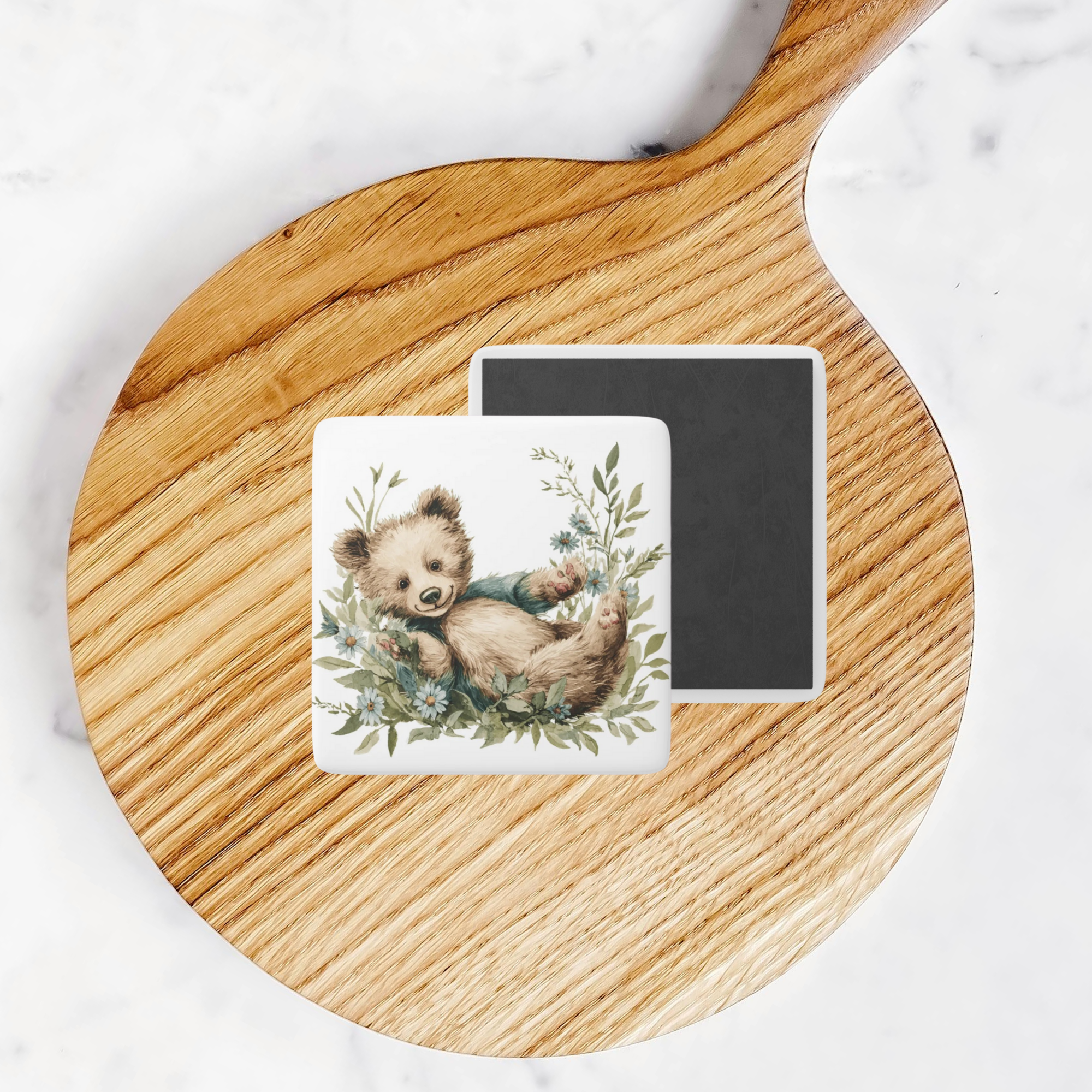 Square magnet with teddy bear design on a round wooden board