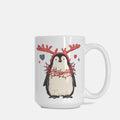 White mug with a penguin wearing reindeer antlers and lights design on a white background