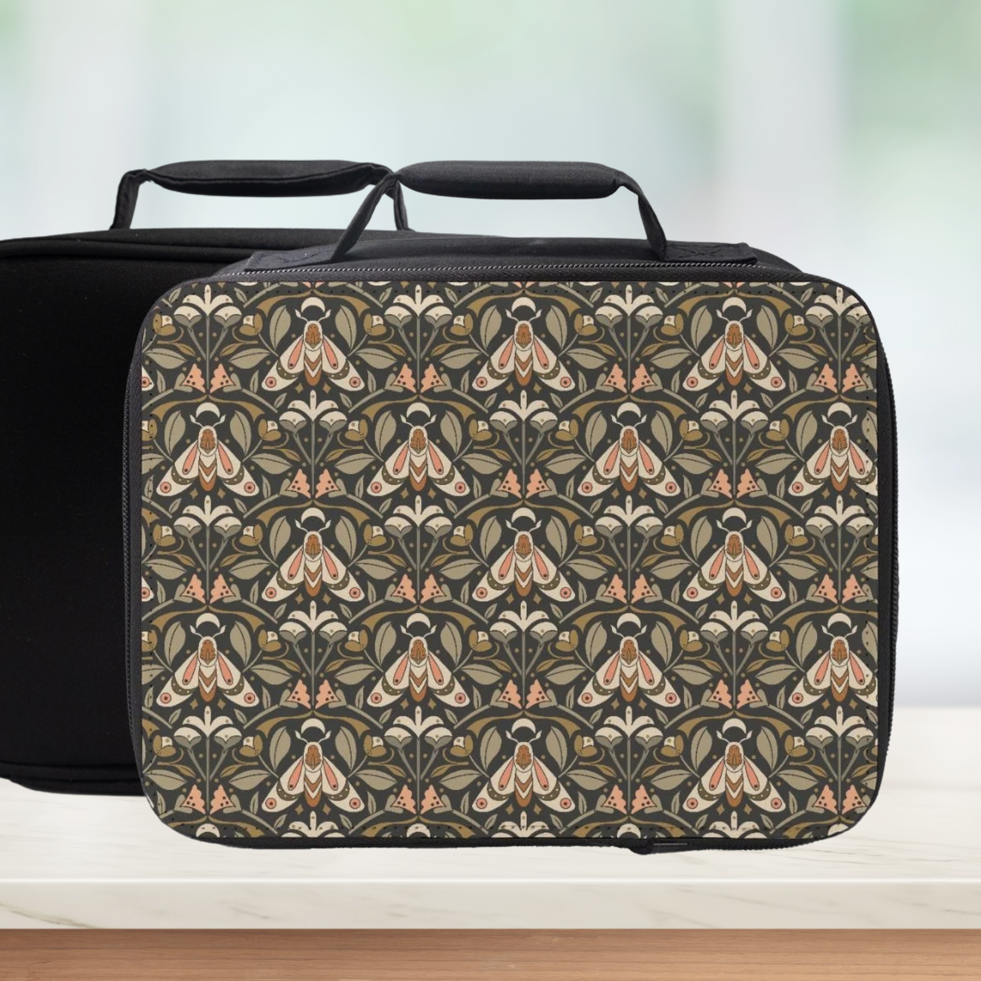 Vintage style moth patterned lunch bag on a counter with a light green background
