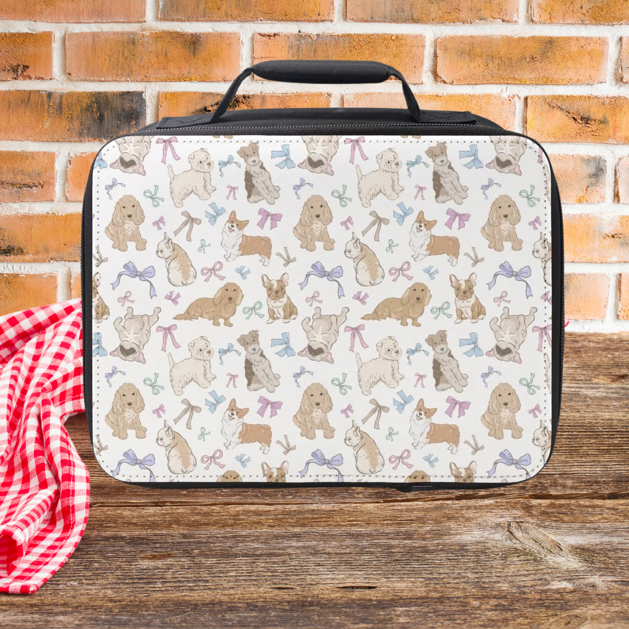 Lunch bag with dog pattern on a wooden picnic table and brick wall background