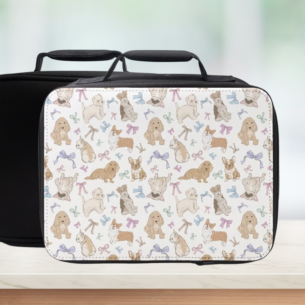 Black lunch bag with a pattern of dogs and bows on a light background