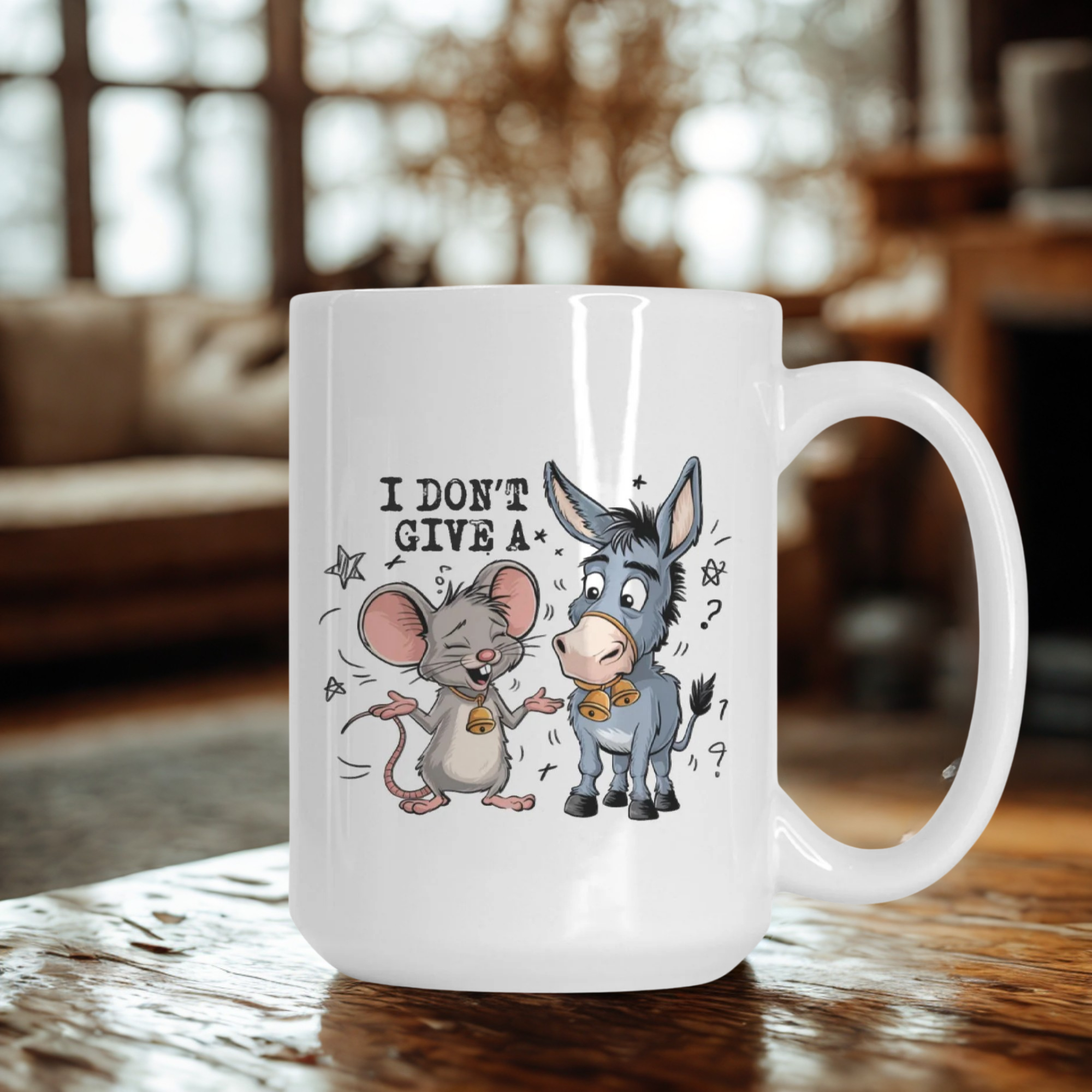White mug with cartoon mouse and donkey design and text 'I Don't Give A' on a wooden surface.