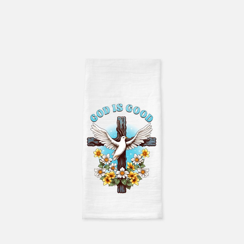 Folded white tea towel with a cross, dove, and 'God is Good' text on a white background