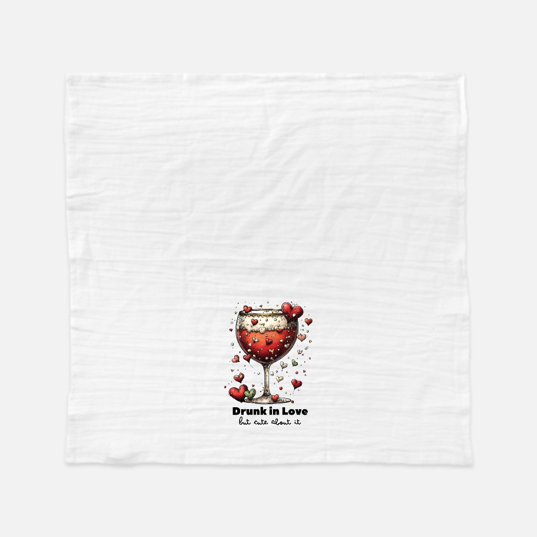White towel with a red wine glass and heart design, text 'Drunk in Love but not about it' on a white background