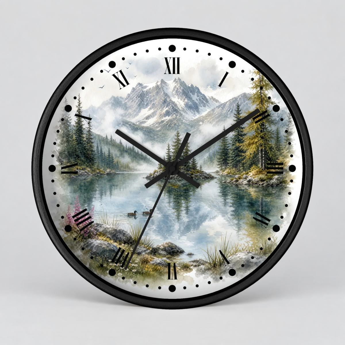 Round wall clock with a black frame and a scenic mountain lake print on the face, featuring black Roman numerals and black hands, shown against a light gray background.