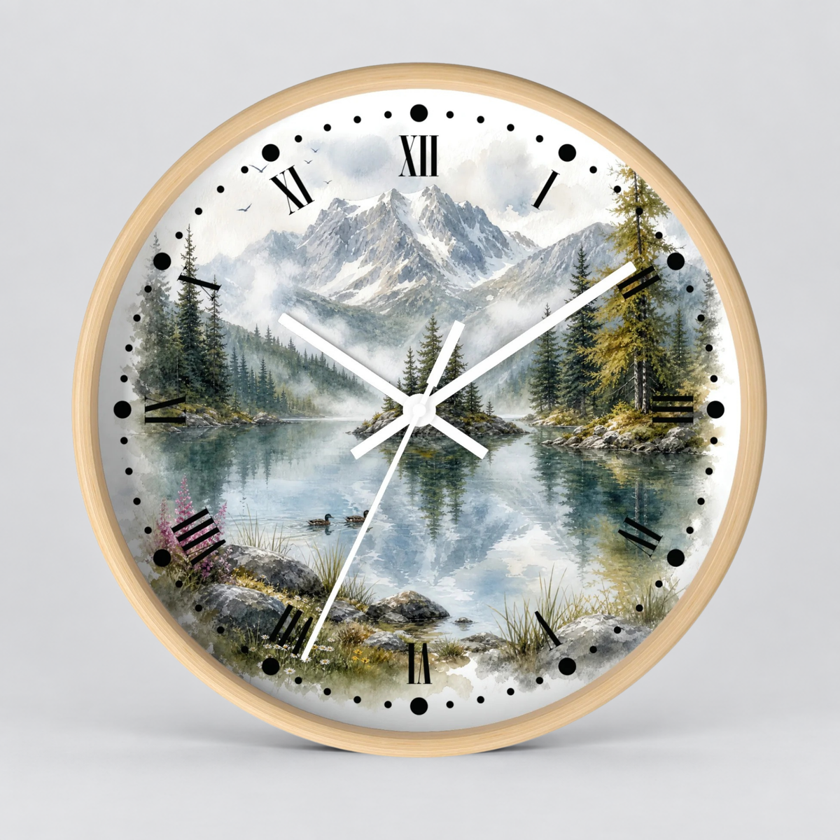 Round wall clock with a light wood frame and a scenic mountain lake print on the face, featuring black Roman numerals and white hands against a light gray background.