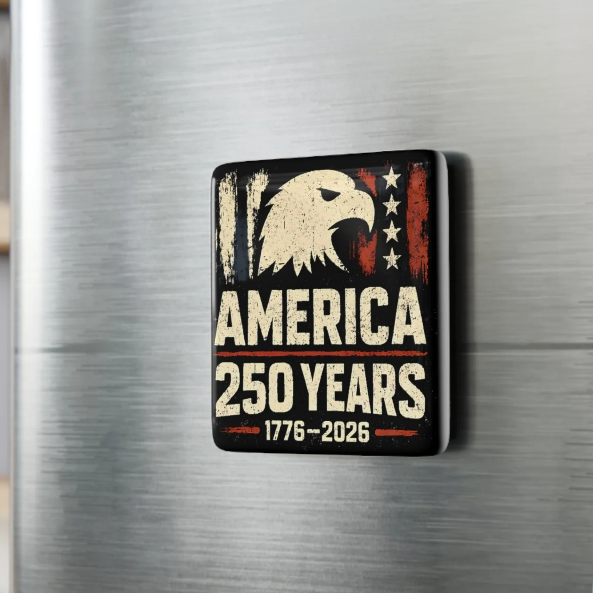 Fridge magnet with American eagle design and 'America 250 Years' text on a metallic surface