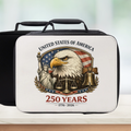 Lunch box with American-themed design featuring an eagle, Statue of Liberty, and Liberty Bell on a white background.