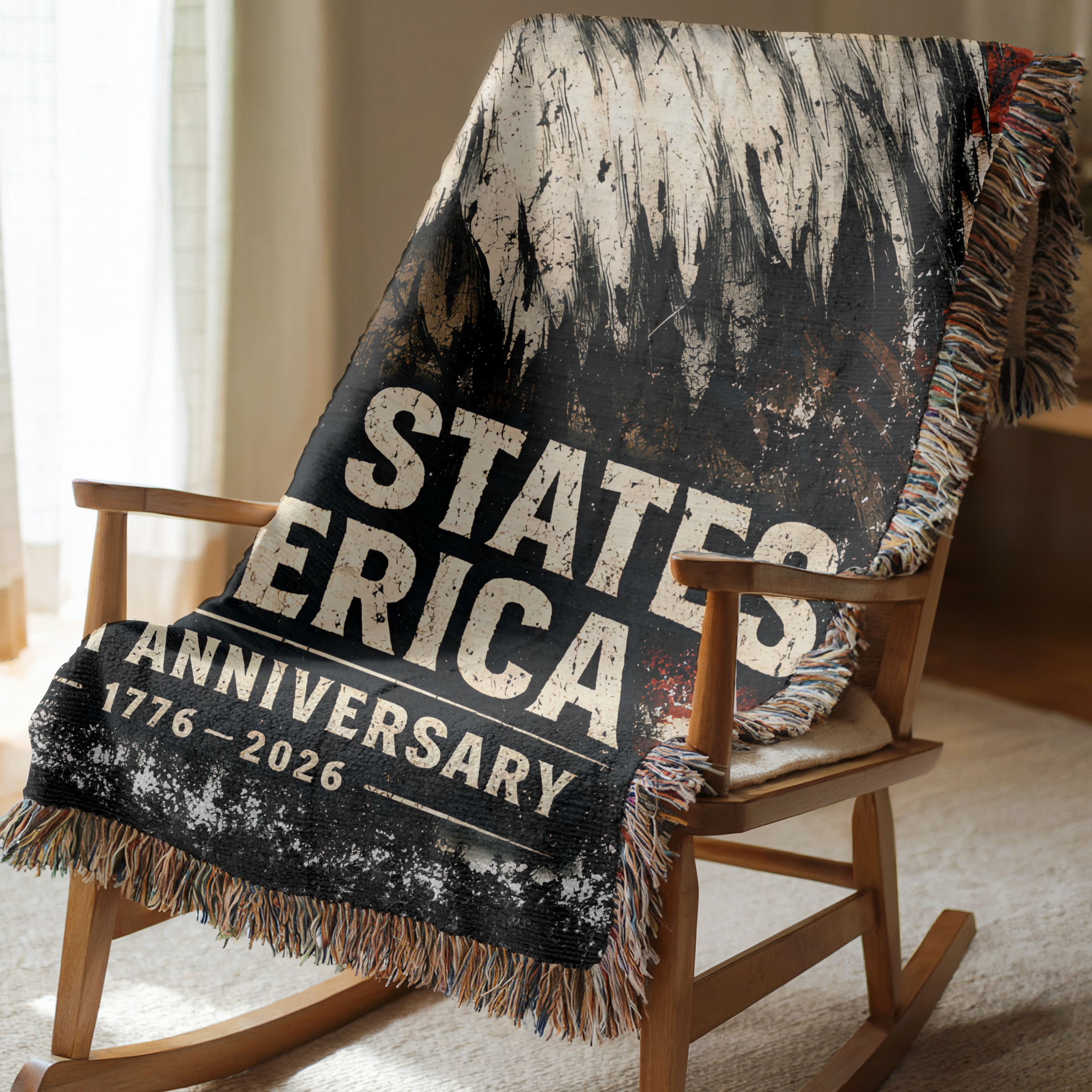 Woven Blanket with 'States of America Anniversary' text draped over a wooden rocking chair.