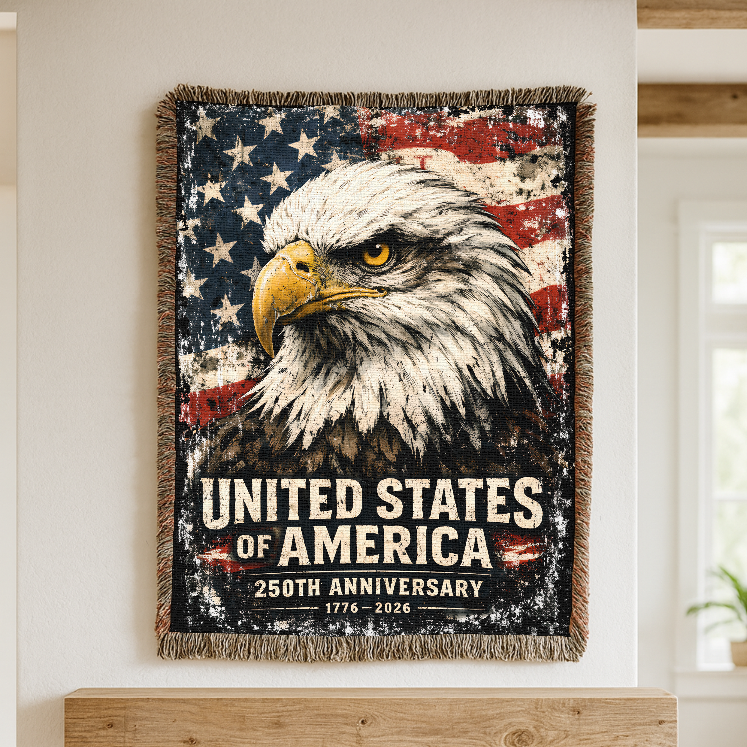 Woven blanket with an eagle design and 'United States of America 250th Anniversary' text, displayed on a wall.