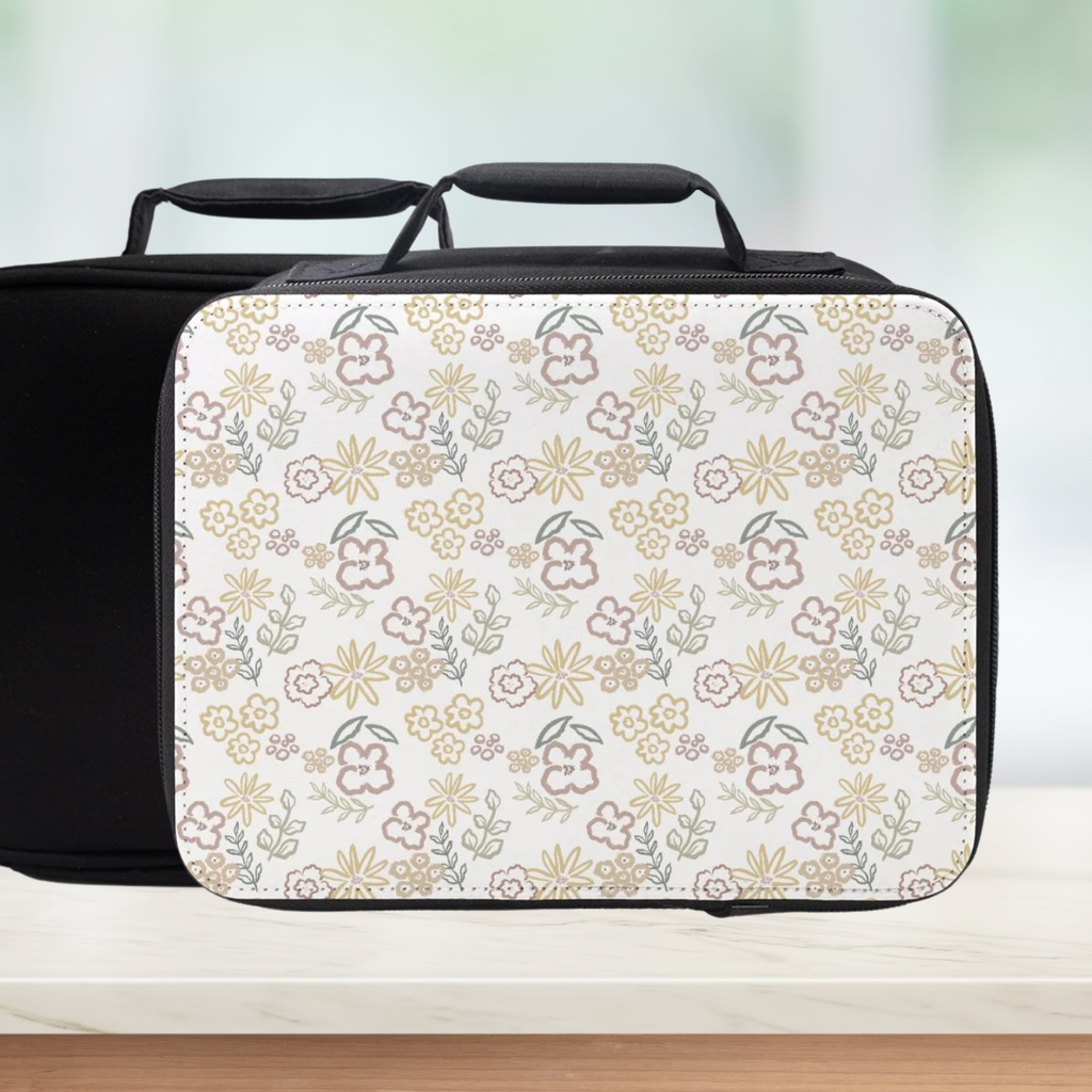 Insulated lunch bag with floral pattern on a white background