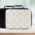 Insulated lunch bag with floral pattern on a white background