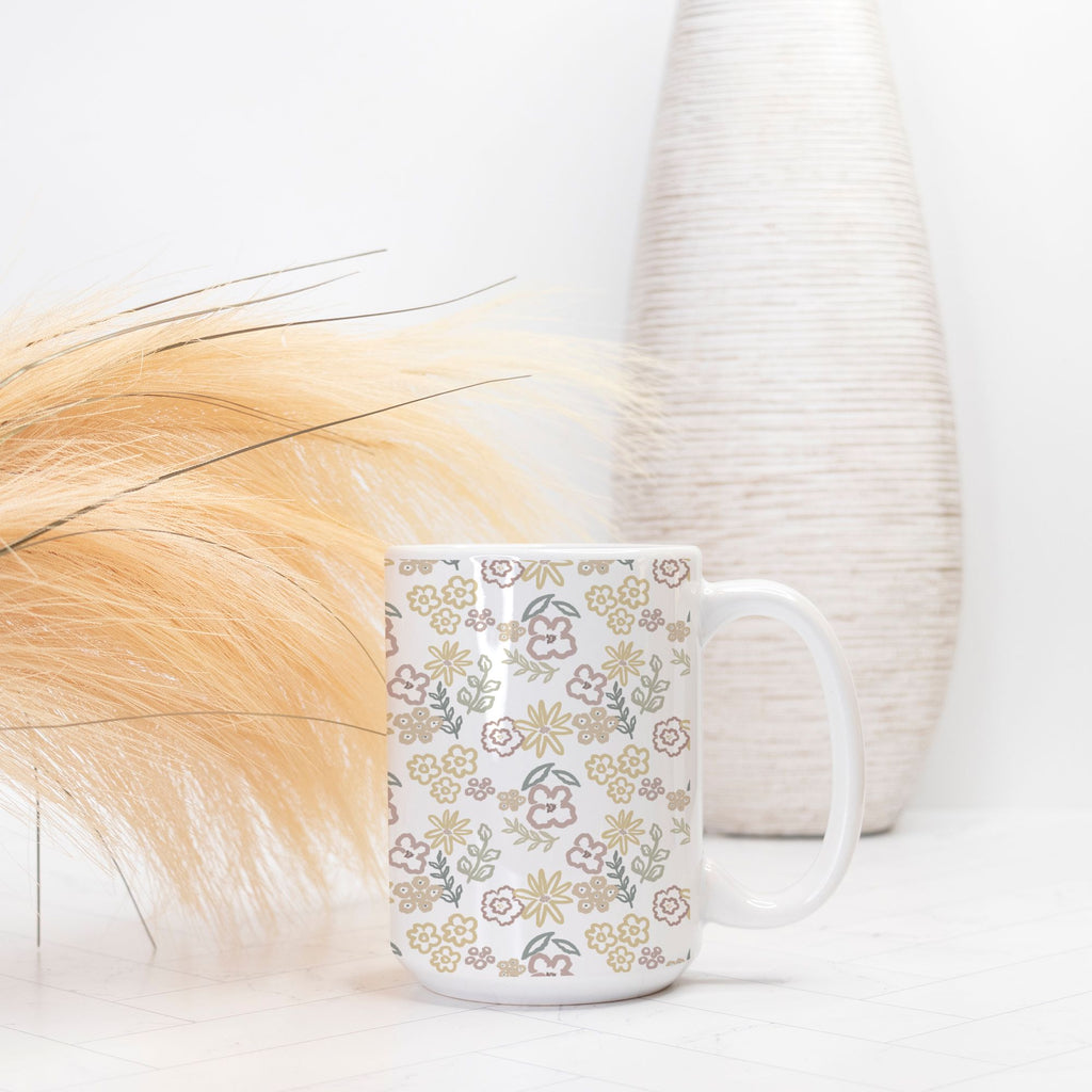 White mug with floral pattern on a light background