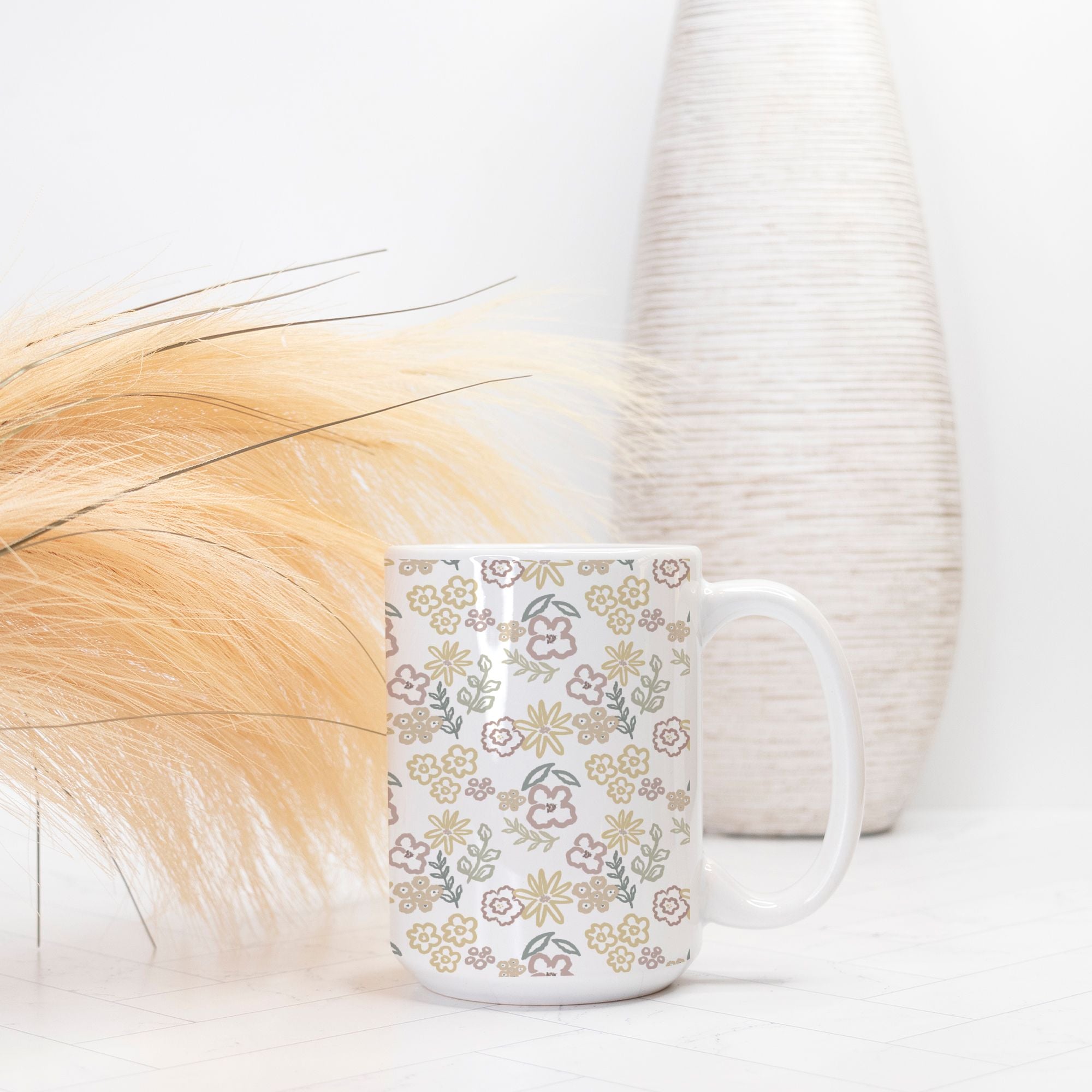 White mug with floral pattern on a light background