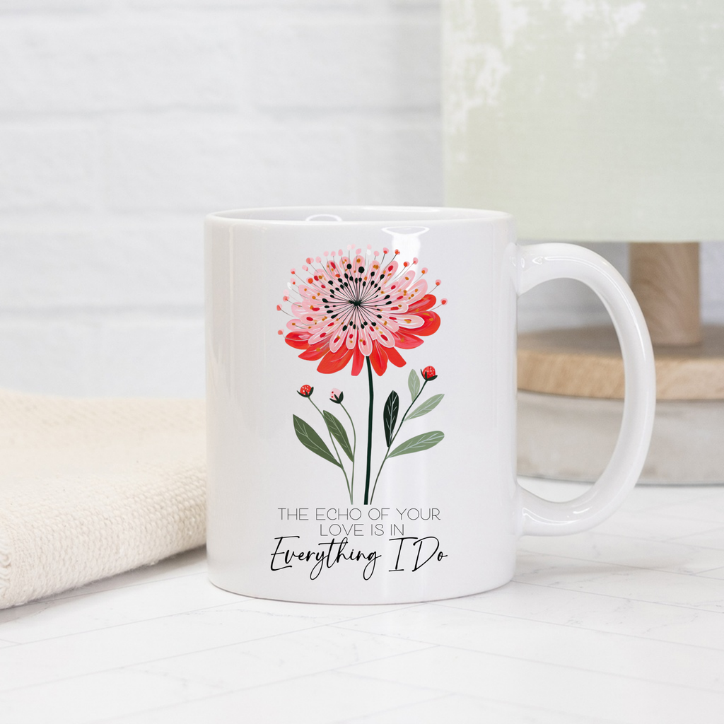 White 11oz mug with a red flower design and text on a light background