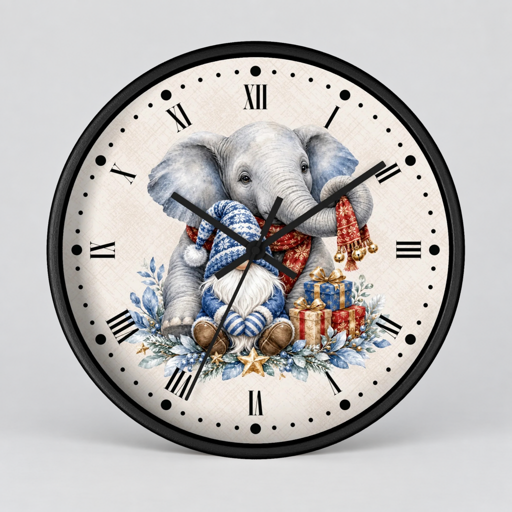 A round wall clock with a black frame and Roman numerals, featuring a festive illustration of a gray elephant wearing a blue knit hat and red scarf, surrounded by wrapped gifts and blue floral details on a light background.