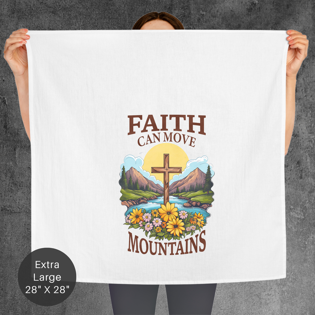 Person holding a towel with 'Faith Can Move Mountains' design against a gray background