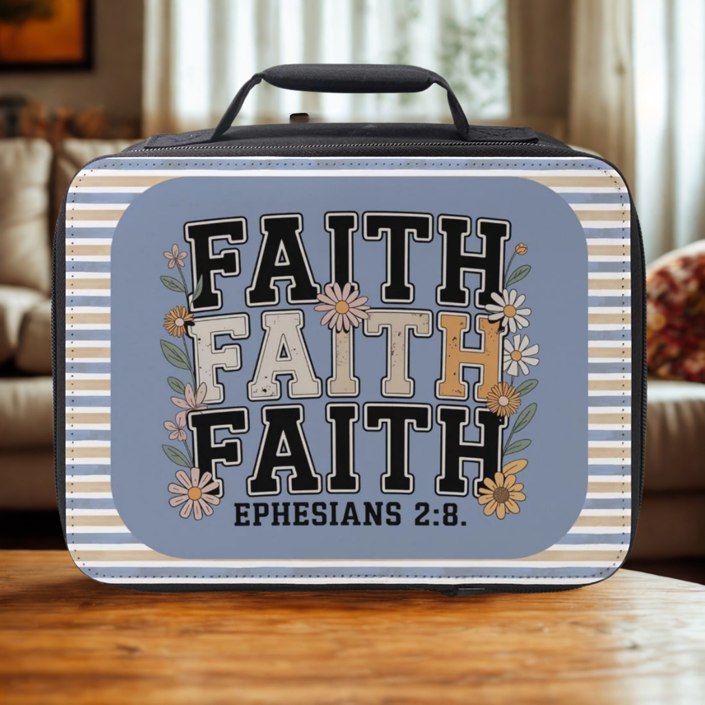 Lunch box with 'Faith' text and floral design on a wooden coffee table
