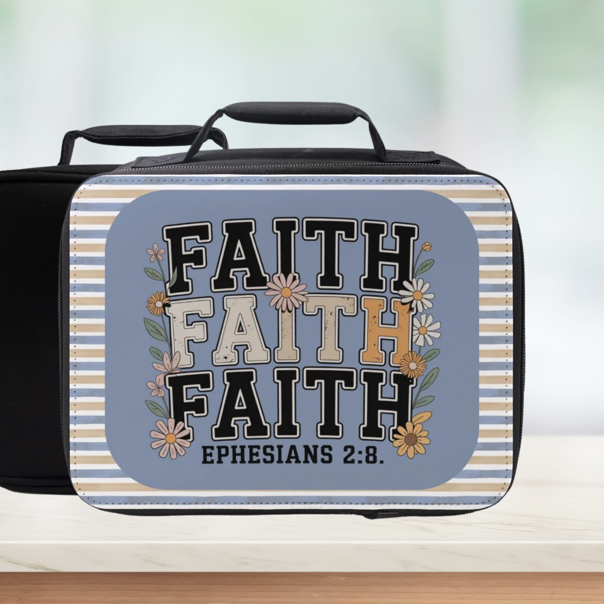 Lunch bag with 'FAITH' text and floral design on a striped background