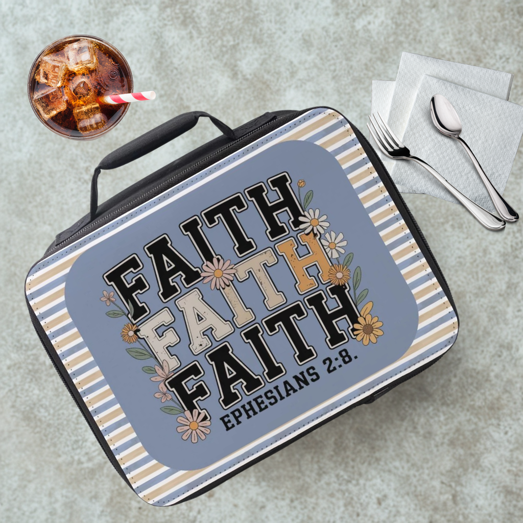 Insulated Lunch Box with bible quote on a cafeteria table with a drink and untensils.