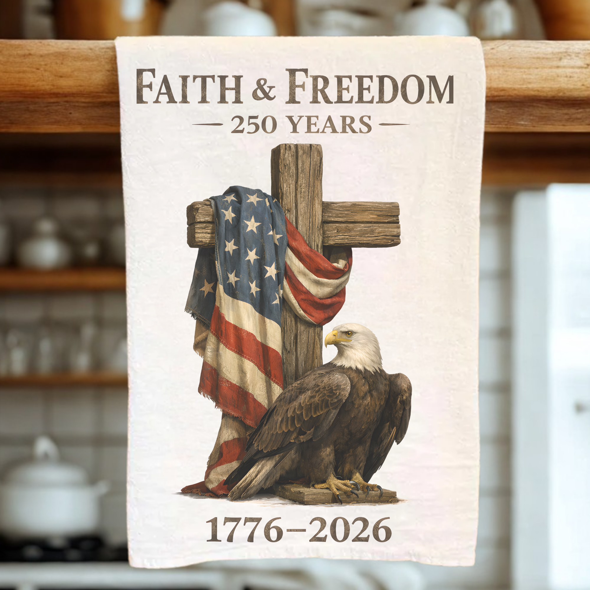 Tea towel with cross, American flag, and bald eagle design, celebrating 250 years of 'Faith & Freedom' from 1776 to 2026.