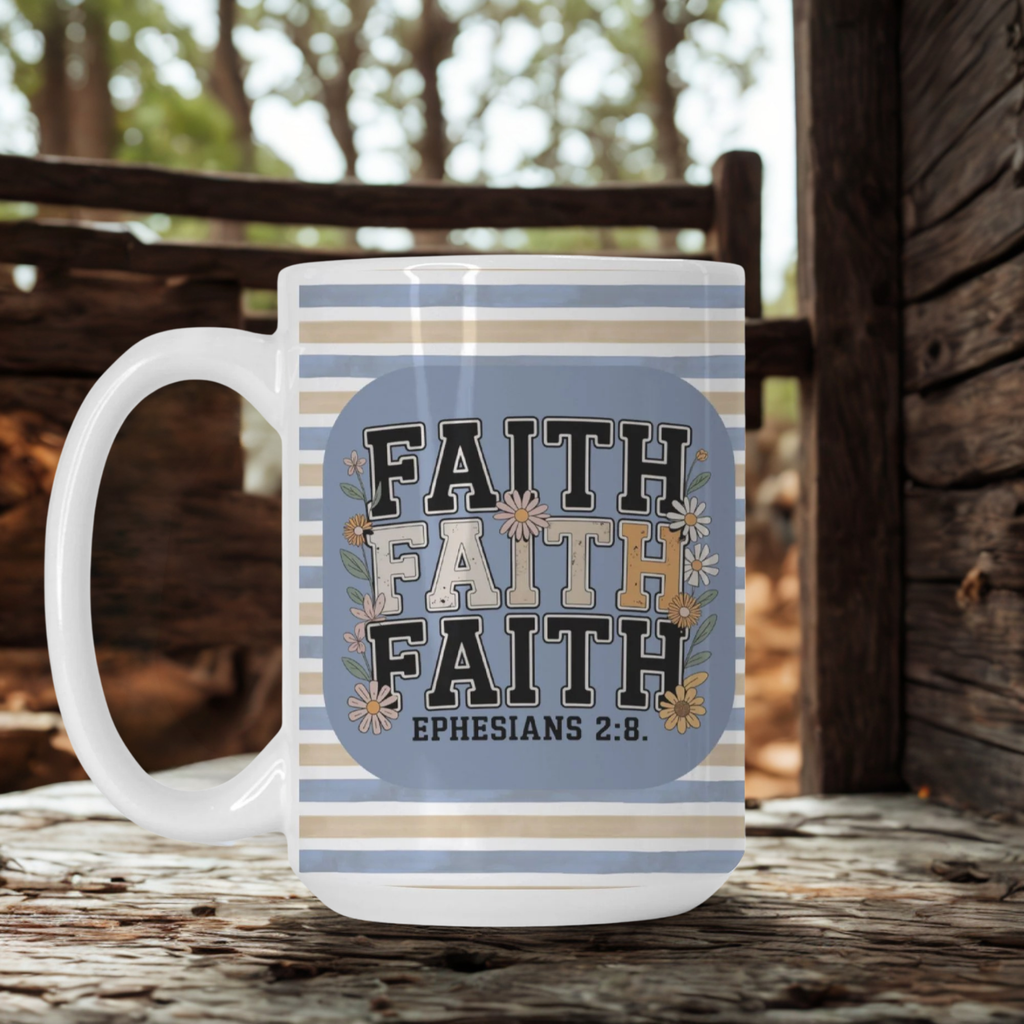 Mug with 'Faith' text and floral design on a wooden surface