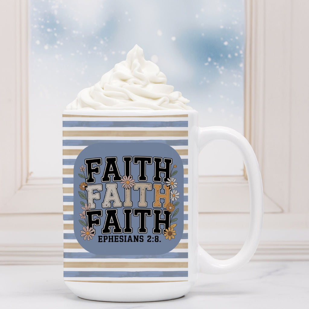 White mug with 'Faith' text and stripes, filled with hot chocolate and whipped cream.
