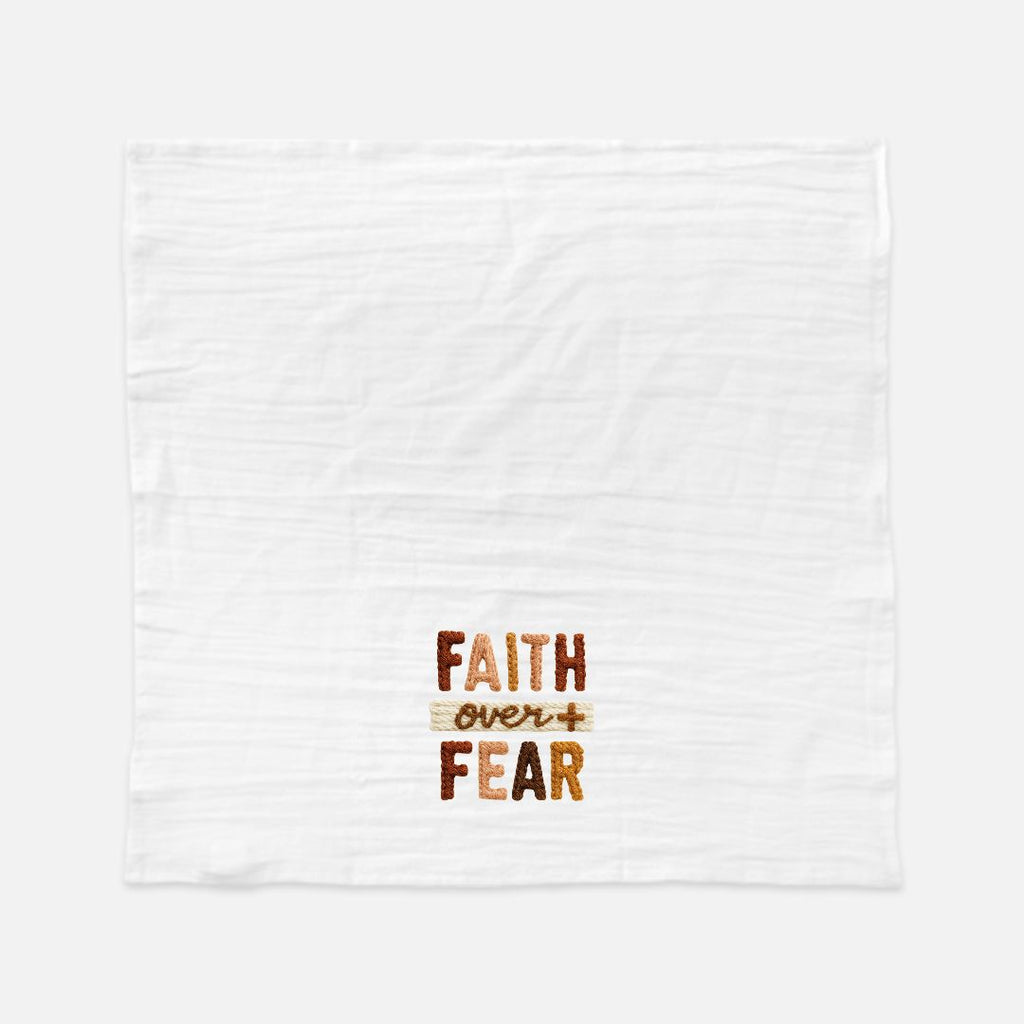 White extra large tea towel with a knitted Text design 'Faith Over Fear' on a white background