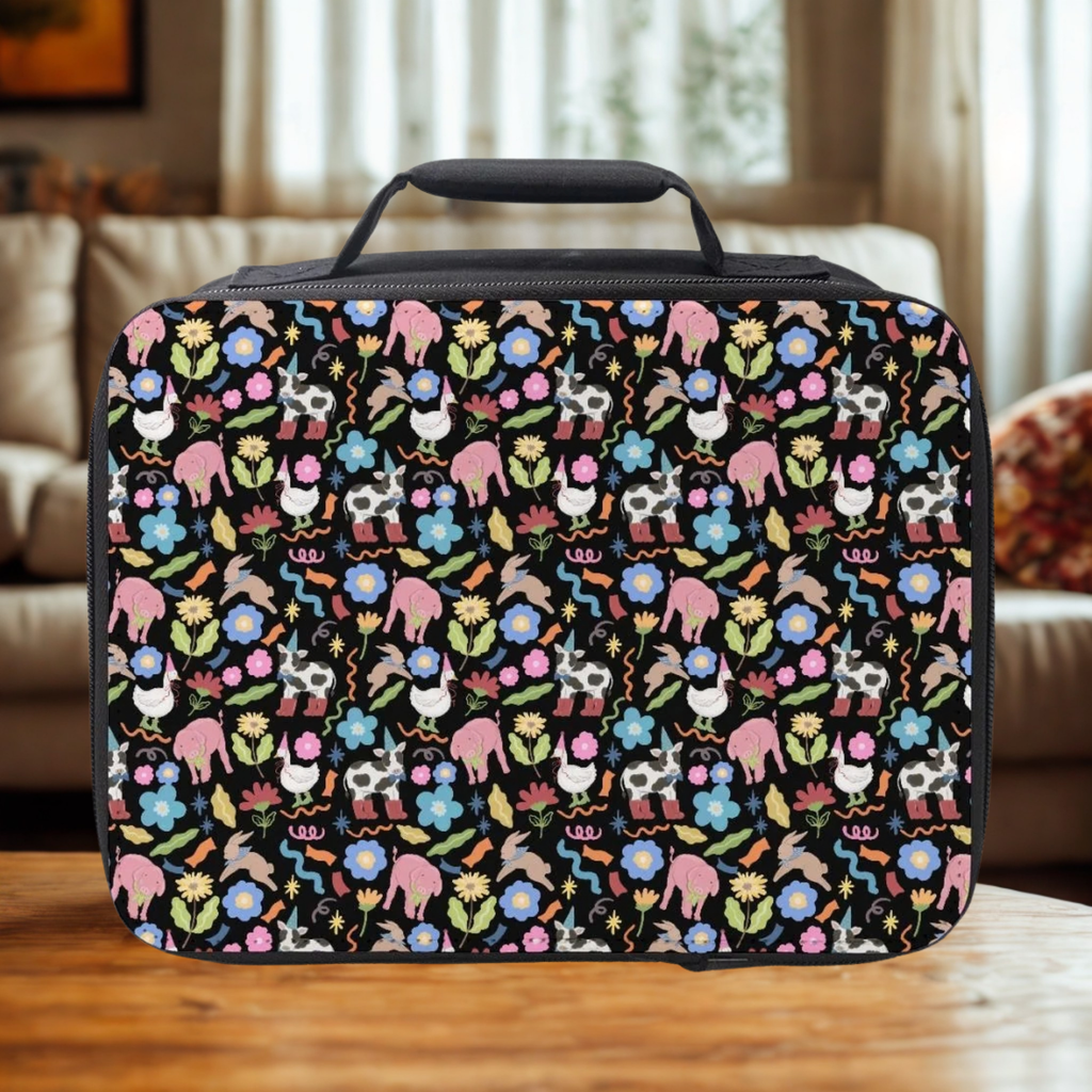 Colorful animal and floral patterned lunch bag on a wooden coffee table with a blurred living room background