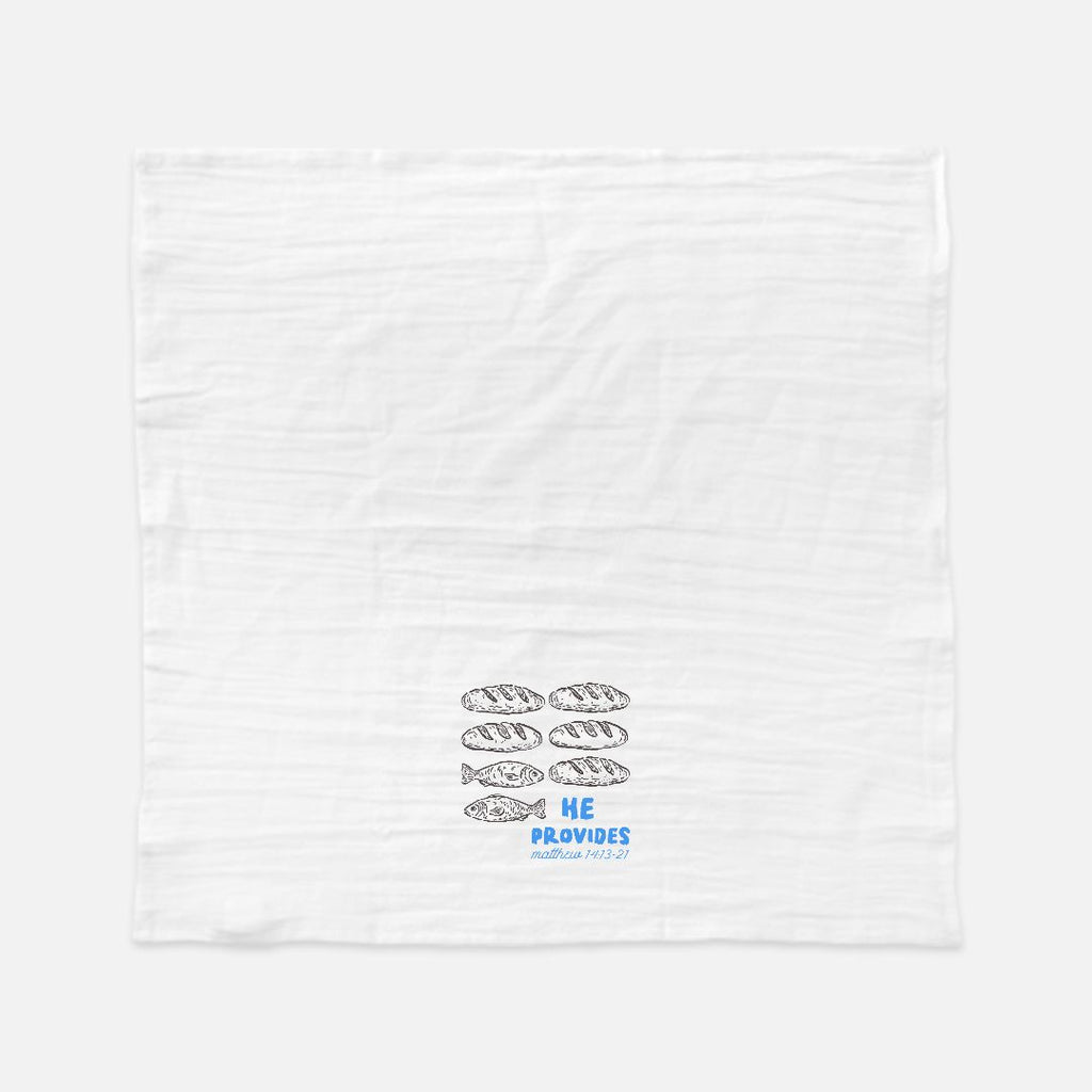 White towel with fish illustrations and text on a white background