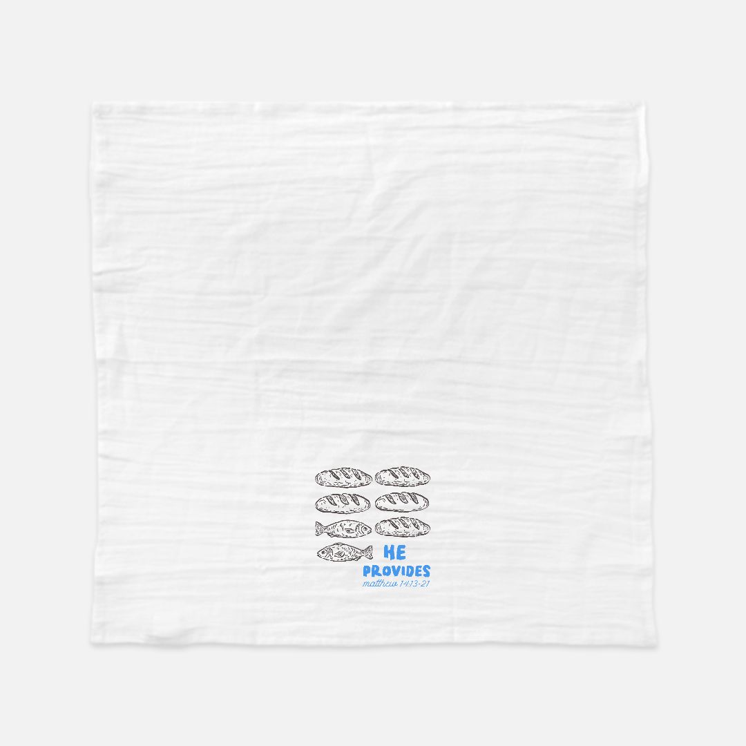 White towel with fish illustrations and text on a white background
