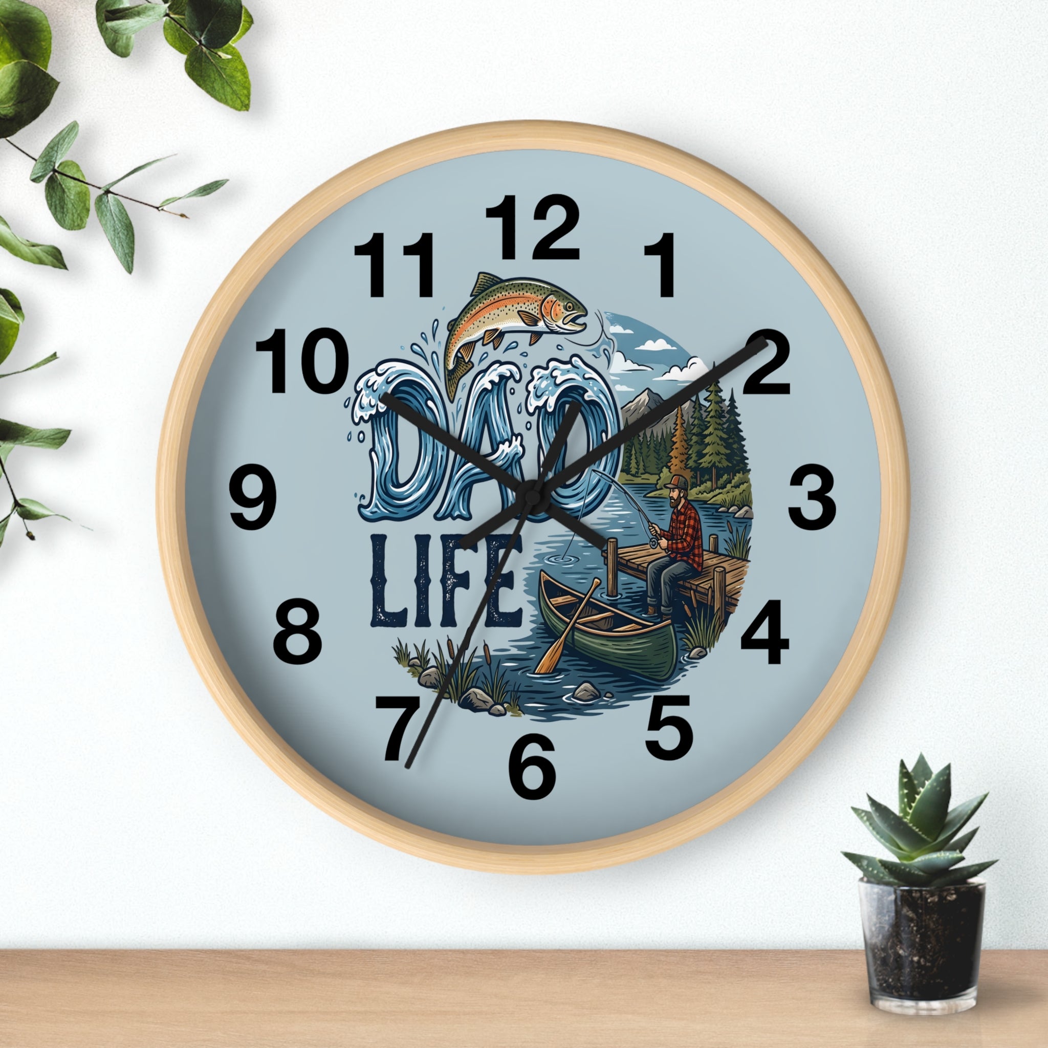 Round Wooden Father's Day wall clock with nature-themed design on a light blue background, featuring a fish, mountains, and a lake.