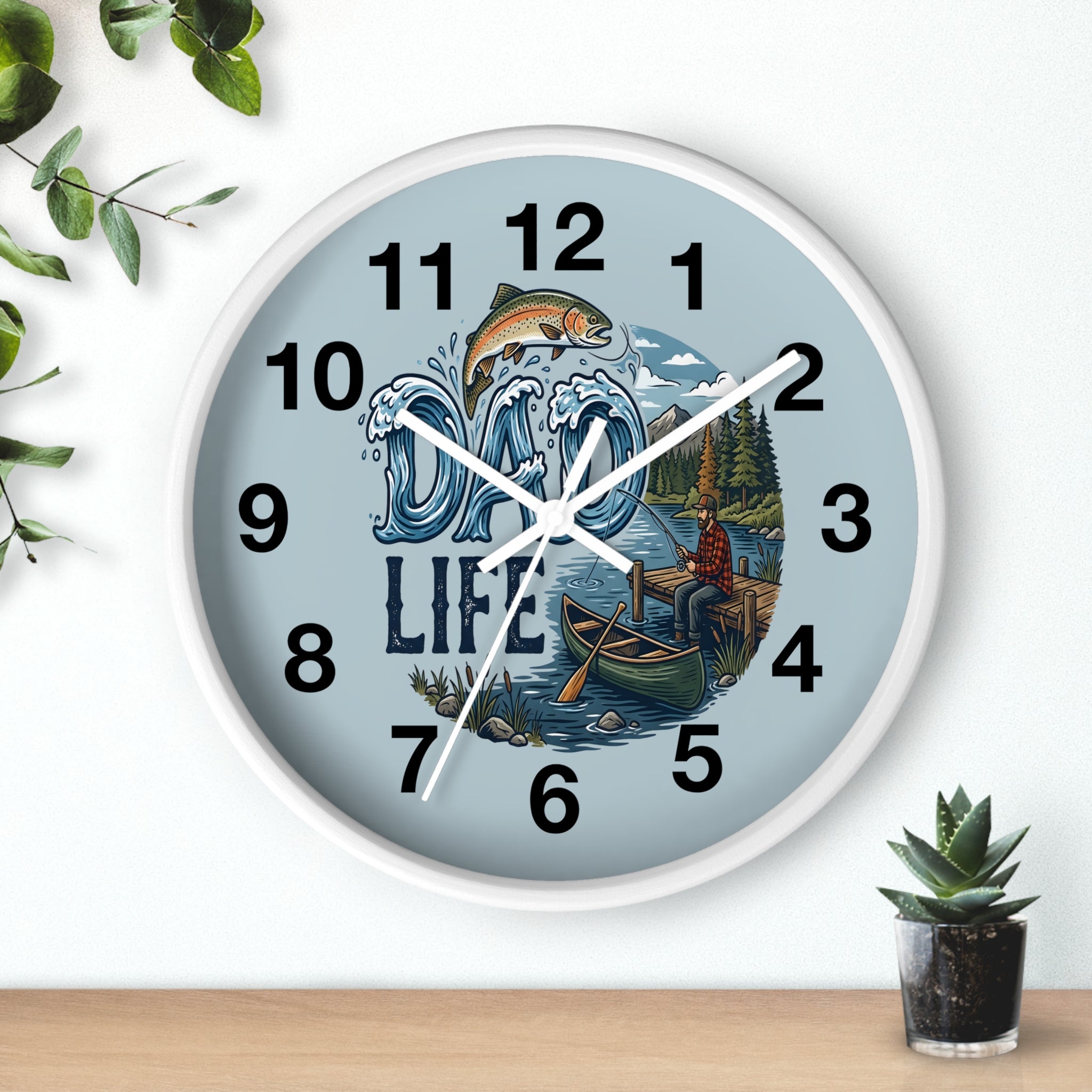Round White Wall clock with nature-themed 'Dad Life' design of a man fishing on a white wall with plants.